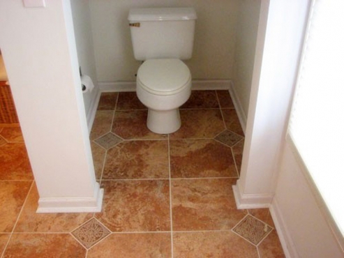 Bathroom Remodel with separate toilet area and custom tile flooring installed in Cleveland Hgts. OH