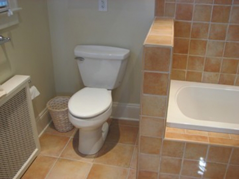 Remodeled bathroom with tile flooring, shower and tub in Shaker Heights, OH