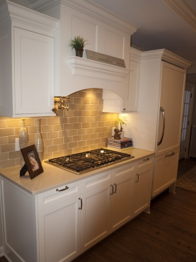 Six burner range, pot filler and concealed commercial grade hood with ten-inch vent. The Beard Group removed the servant’s staircase to make room for this area.